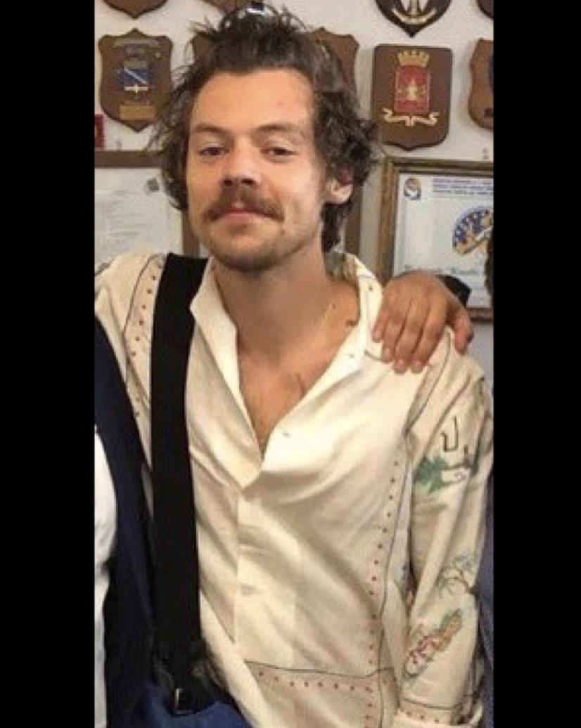 Harry Styles' 70s-Inspired Mustache: A London Appearance Harry Styles' 70s-Inspired Mustache: A London Appearance